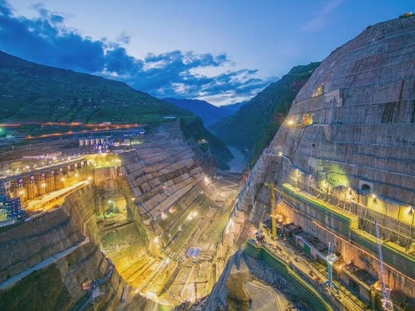 Baihetan Hydropower Station: (a) Double-curvature arch dam; (b